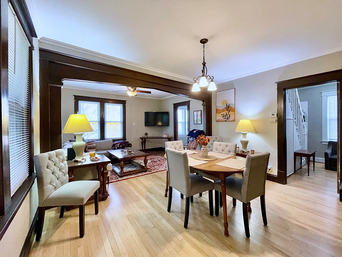Open, comfortable living room and dining room with new hardwood flooring. - 2507 N 23rd St #A