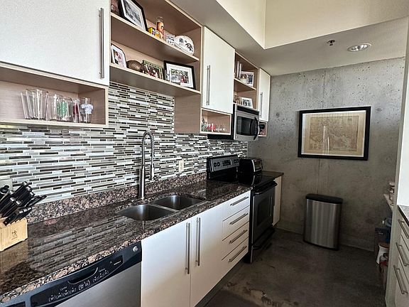 Industrial sink & faucet. Upgraded backsplash.