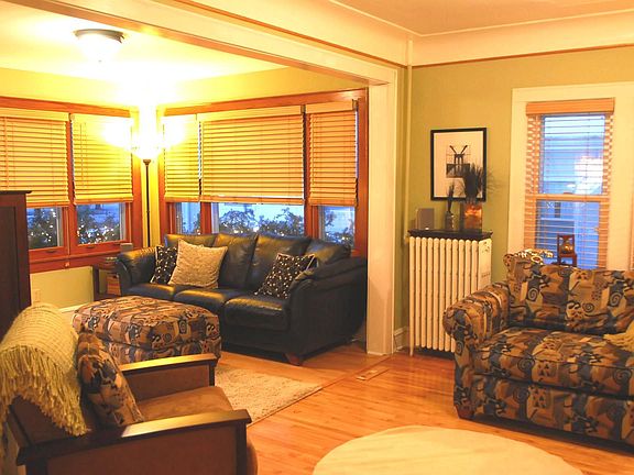 Bright Sitting room adjoins Living room.