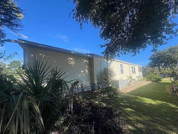 EAST SIDE VIEW OF HOUSE 