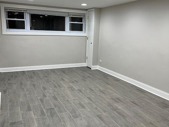 Living Room / Dining Room - Large windows let in good natural light