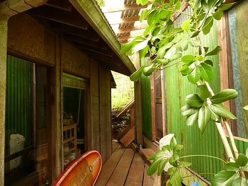 Deck area between main house area and lanai bedrooms on right