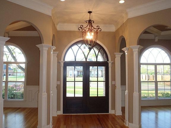 Entering the house thru the front door.