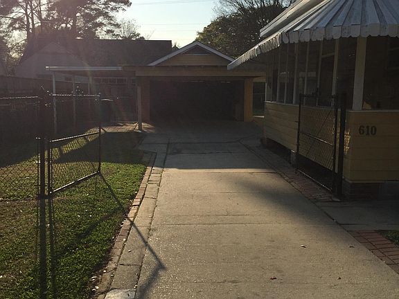 Fenced yard, garage, carport, under cover boat port and addi