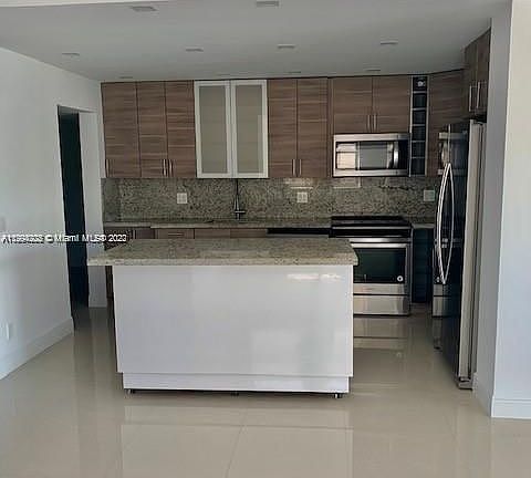 2nd image of 9500 W Bay Harbor Dr APT 2E