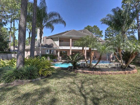 Surrounded by tall trees, lush landscaping, and planting beds, the outdoor living and entertaining spaces are shaded and easily enjoyed. Extra green lawns leave room for extended entertaining areas, play equipment, etc. A sprinkler system is a plus.