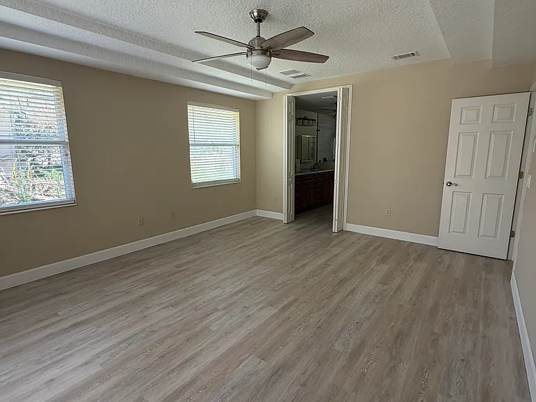 Large Primary Bedroom with convenient slider to patio & swim-spa