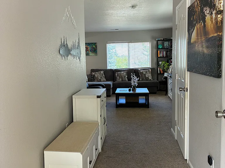 As you enter there is a powder bath and you walk toward the living room