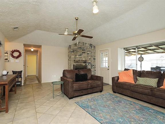 View through living room of hallway leading to bedrooms and bathrooms