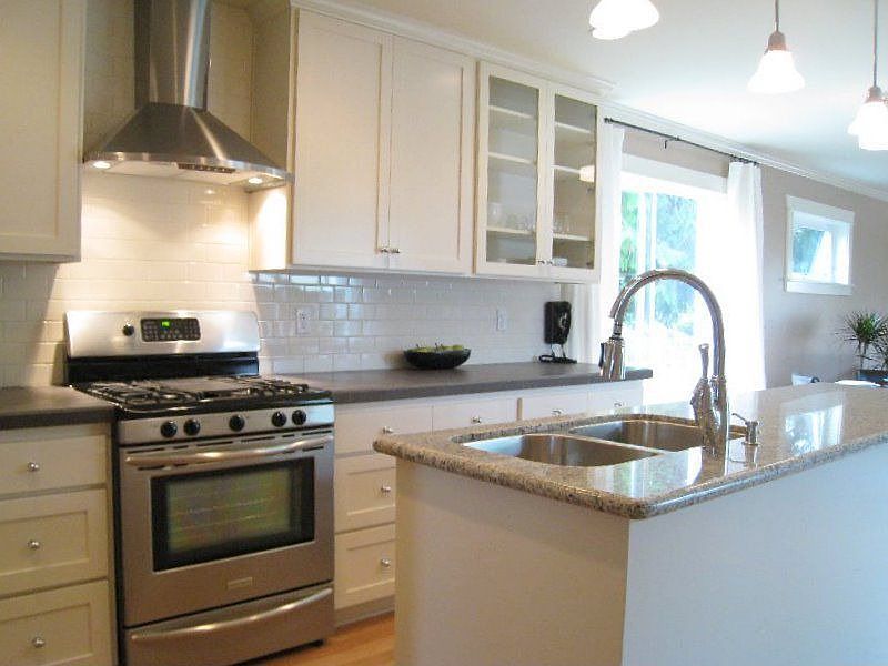 Fabulous kitchen with stainless steel appliances and hood 