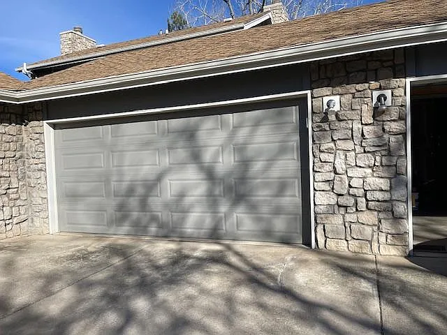 Two car garage attached with access behind townhouse.