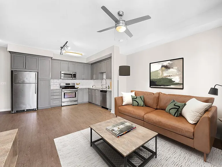 Kitchen, living, and dining area with hard surface flooring