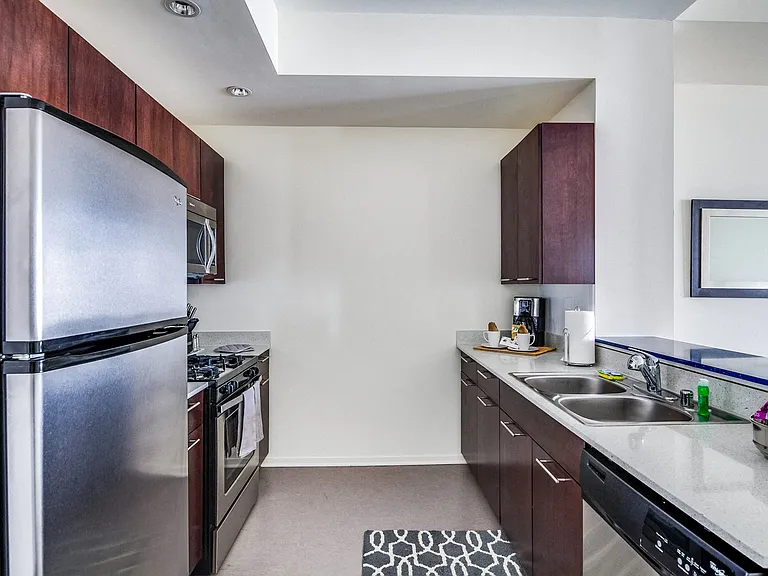 Chef-inspired kitchens with gas ranges, dishwashers, quartz counter tops and breakfast bars