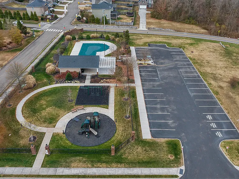 A premier neighborhood gathering space complete with play ground equipment, inclusive swing sets, accessible sidewalk, and relaxing park benches, Pergola with plenty of tables and seating, attached to bathrooms, changing areas and swimming pool