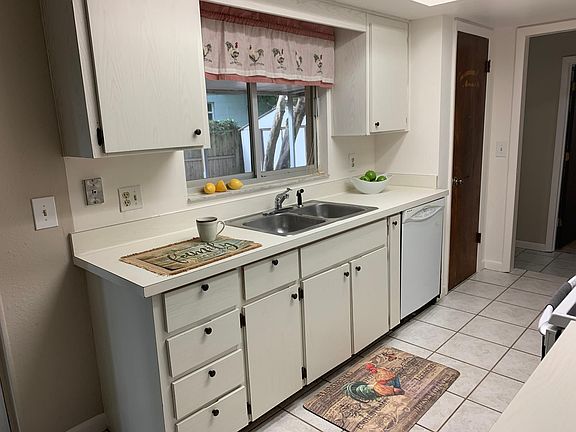 Dishwasher, pantry and window pass thru to patio