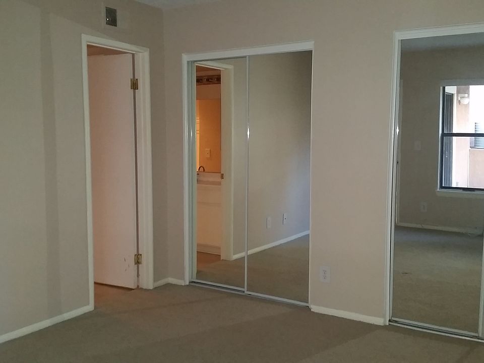 Large Bedroom with double glass sliding door closet.