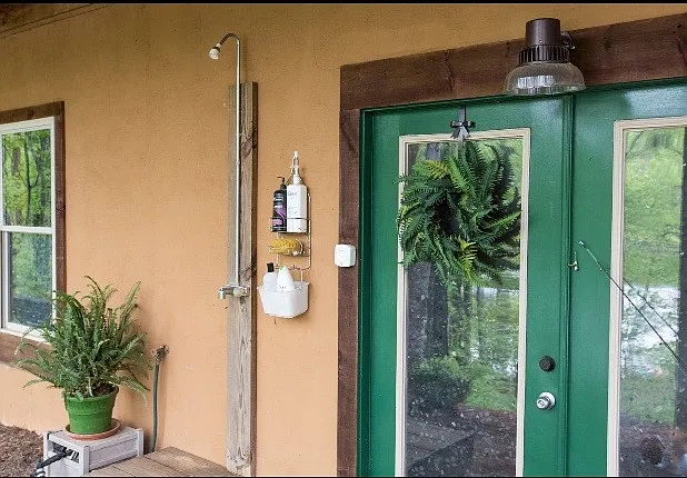 Outdoor hot and cold shower. Unfinished basement available for storage.