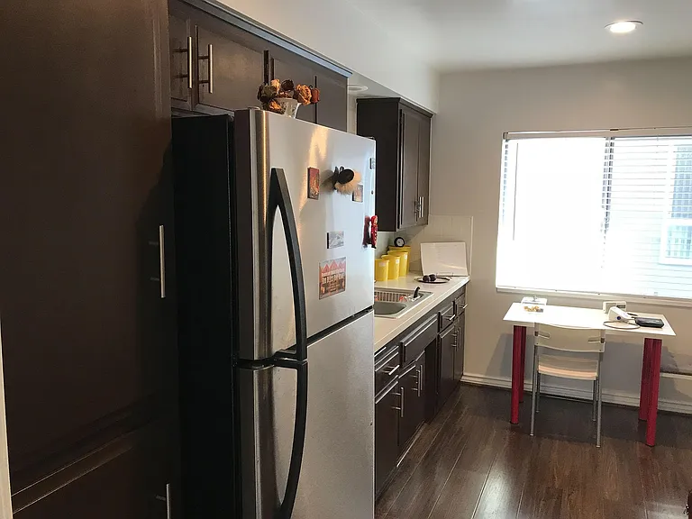 Fully equipped kitchen with refrigerator, microwave, toaster oven, dishwasher and plenty of cabinets
