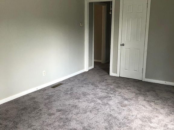 living room - updated light fixtures and new carpets