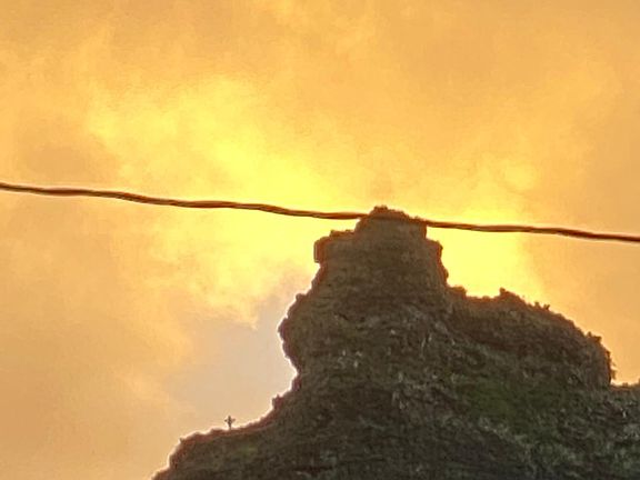 Crouching lion pic from mountain side