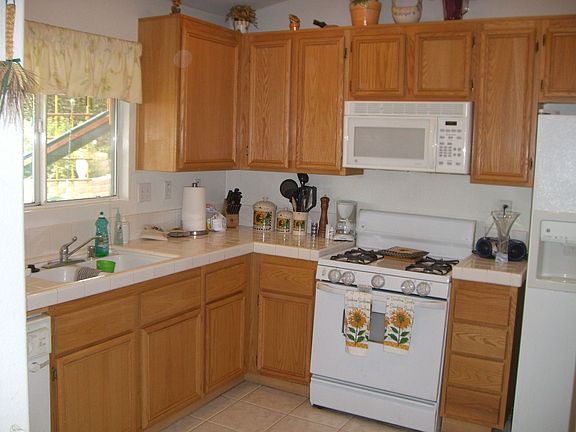 Roomy kitchen w/ tile counter tops.