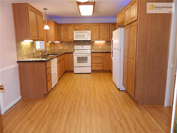 Kitchen with brand new waterproof flooring.