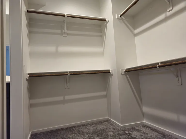 large walk-in closet in the ensuite master bedroom