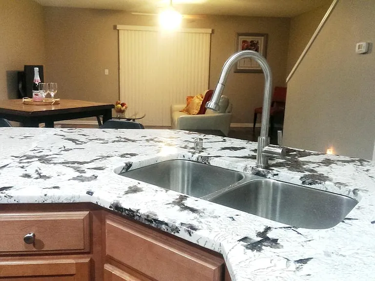deep stainless sink & high arch stainless faucet/sprayer