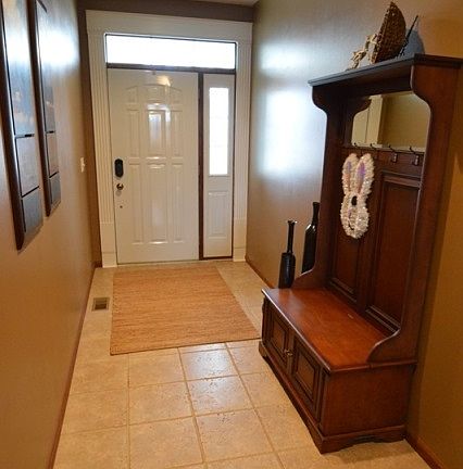 Front entry/spacious foyer with tile flooring.