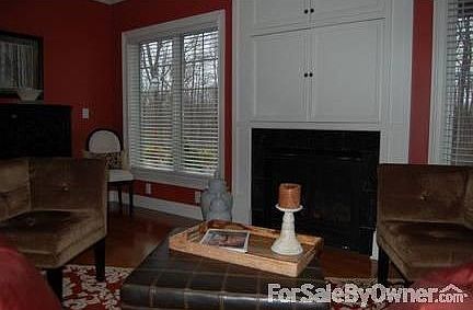 Living Room w/ Private Wooded View
						:
						Two built-in units, crown molding, hardwood floors, gas fireplace, custom blinds