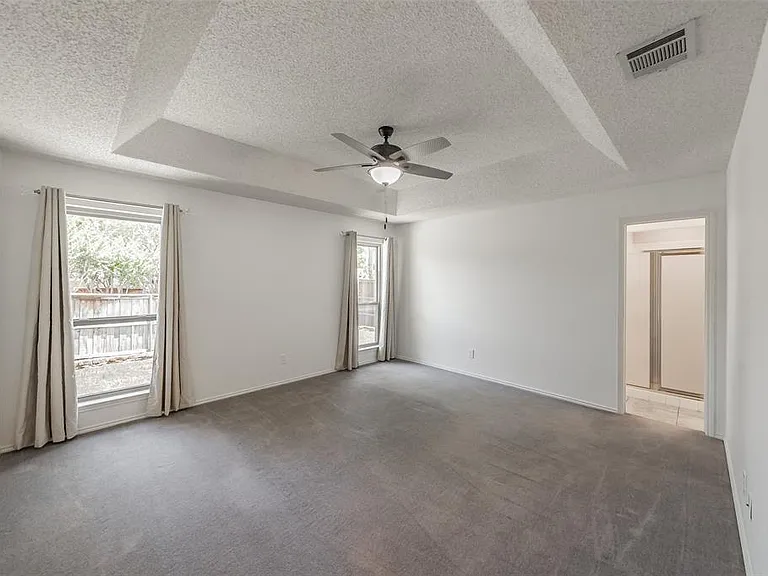 ANOTHER VIEW OF THE PRIMARY BEDROOM