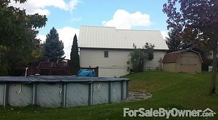 Rear of home
						:
						33 foot pool with multi-level decking and walk out basement to pool area.
