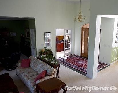 Entry, Den and Great Room
						:
						Marble entry with media room to left and den/office is at center.