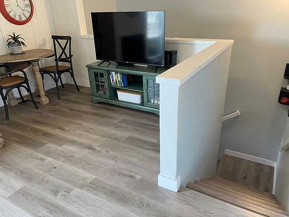 Stairs to ground level front door entrance