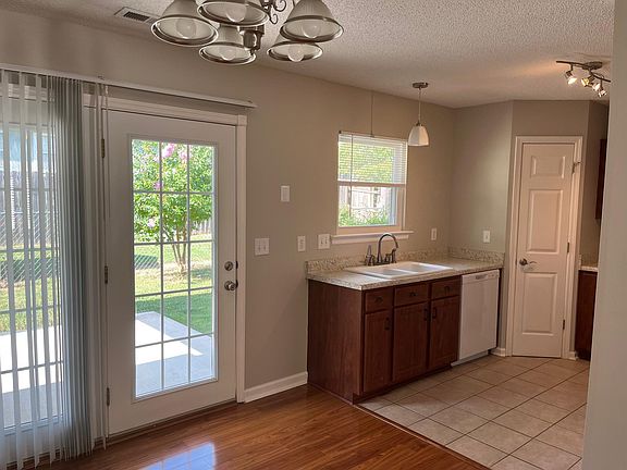 Kitchen with Pantry area. Access to covered patio and backyard