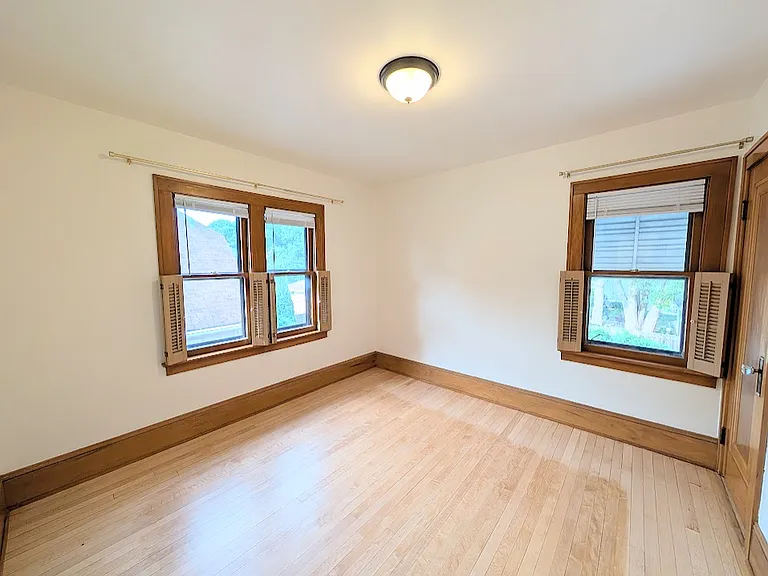[UPPER UNIT]: second bedroom with refinished maple floors