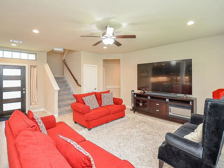 Huge living room with massive windows for plenty of natural light.
