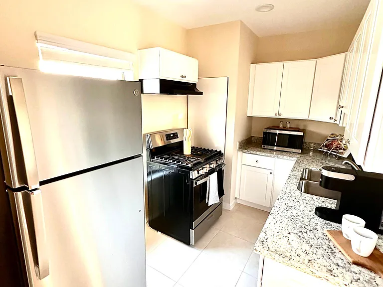 Kitchen has pots, pans, utensils, coffee-maker, microwave, etc. already included.
