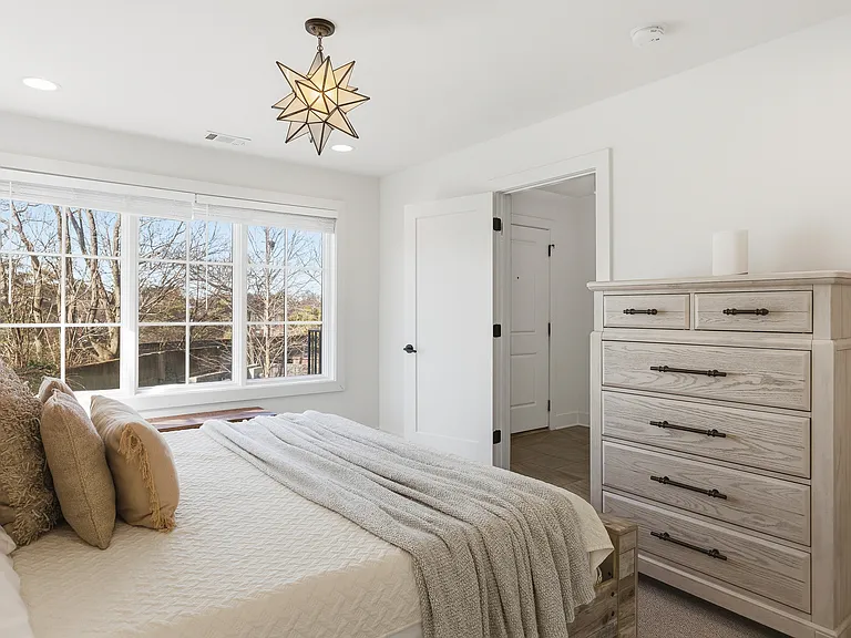 Bedroom 2 with a king bed and ensuite bath. Located on the 1st floor. Tastefully decorated with high-end modern furnishings and thoughtful touches to make your stay as comfortable as possible.