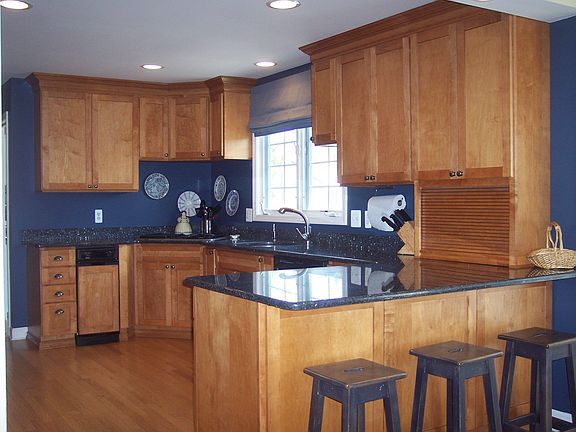 The Kitchen with maple cabs & granite countertops