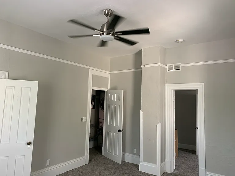 Bedroom, shared laundry access to second exit.