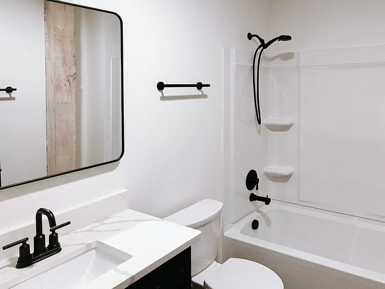 Guest bathroom with vanity and shower/bathtub combo