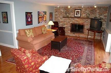 Family Room on Lower Level
						:
						Cherry Wood Pergo floor, natural gas fireplace