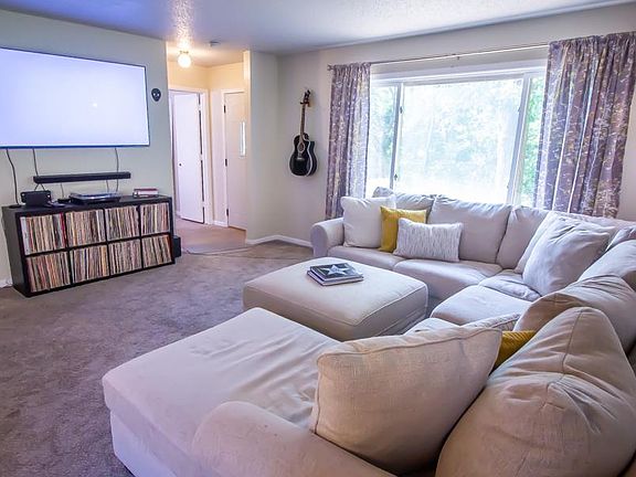Lots of light in the family room that looks out onto the private, fully fenced backyard.