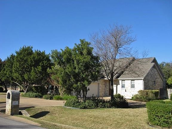 Large driveway and circular drive.  Separate entry to mud room next to garage.