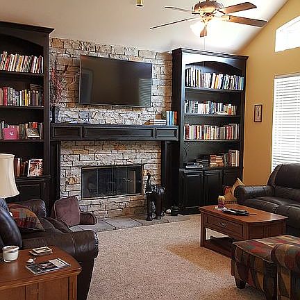 Den with vaulted ceiling