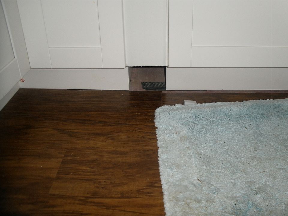 Hard wood flooring in 3 bedrooms; carpeting in Family room, dining room and living room.