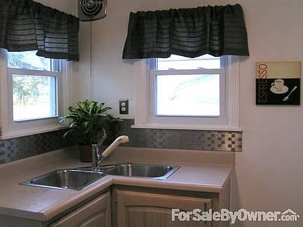 Corner Sink
						:
						Enjoy looking out 2 windows while standing at your stainless steel corner sink.