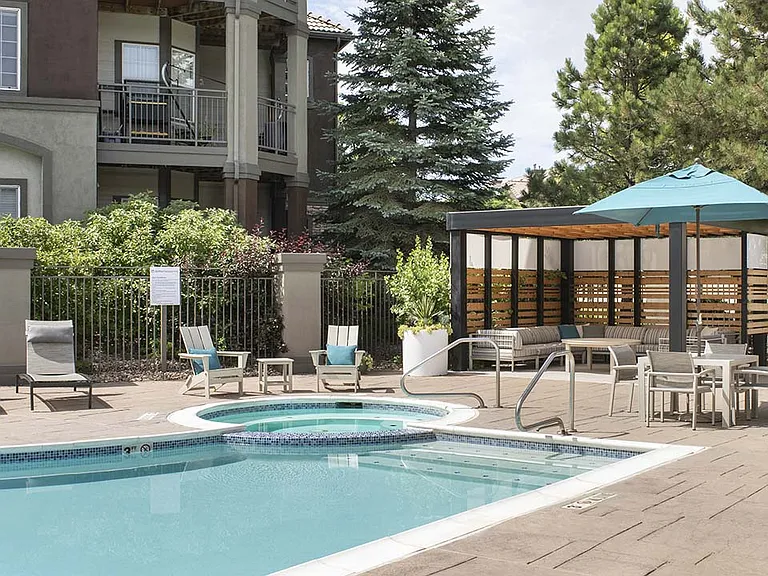 Apartment community resort-style pool + all-season spa at Griffis Belleview Station in Denver, Colorado.