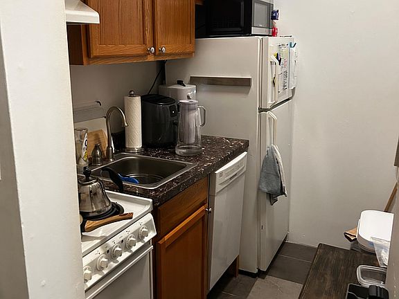 Separate kitchen with dishwasher